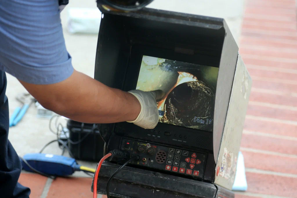 Technician viewing a drain inspection camera in Westminster